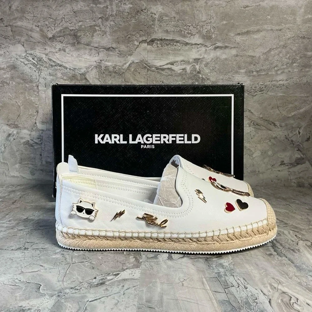 Karl Lagerfeld pins symbolizing